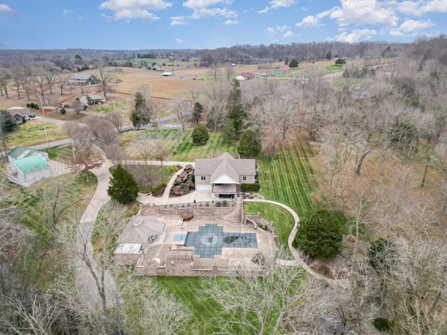 a backyard of a house with plants and trees