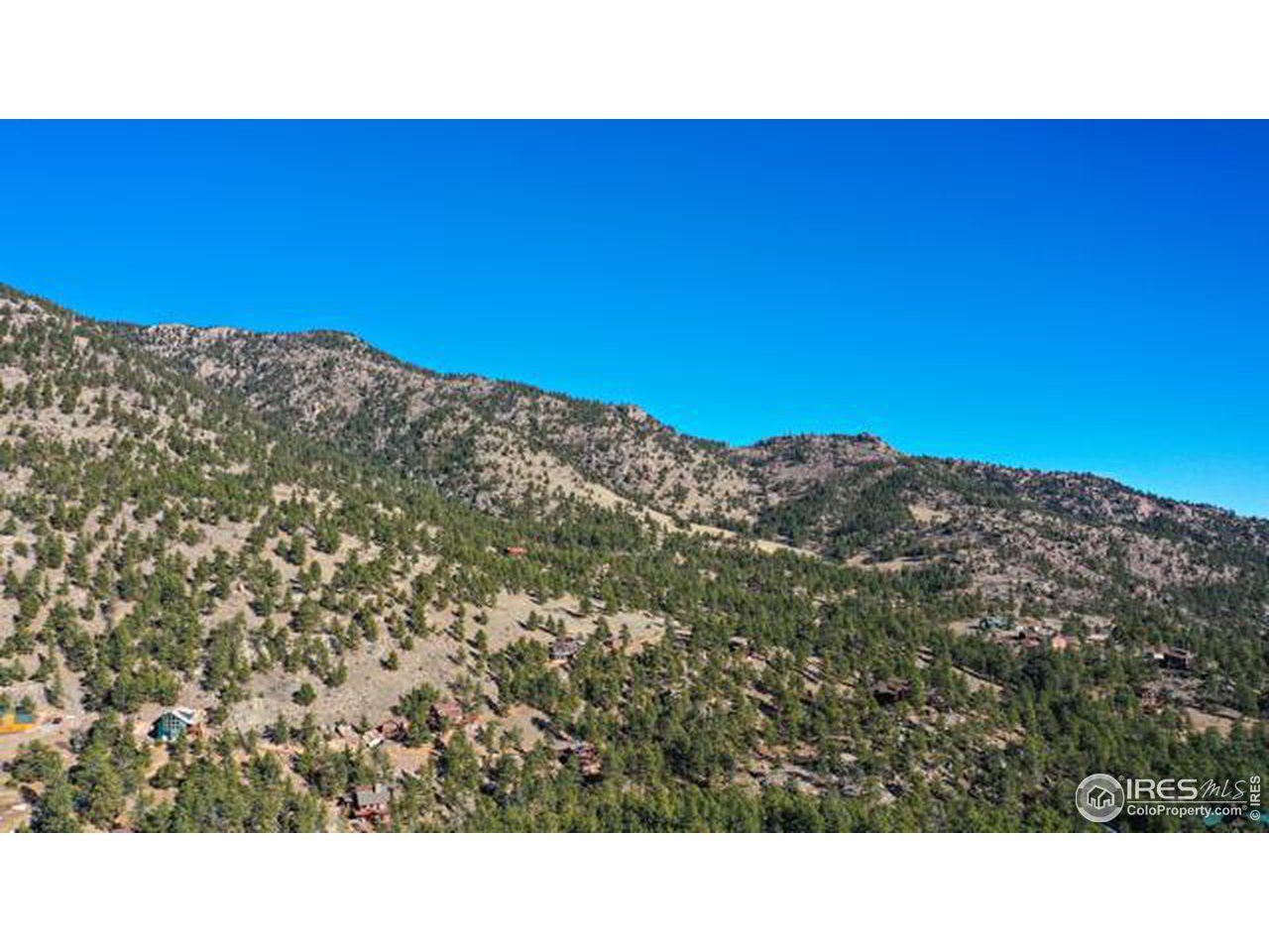 0 Tbd) Pima Road Lyons, CO 80540 - Photo 5 of 31 a black and white photo of a mountain