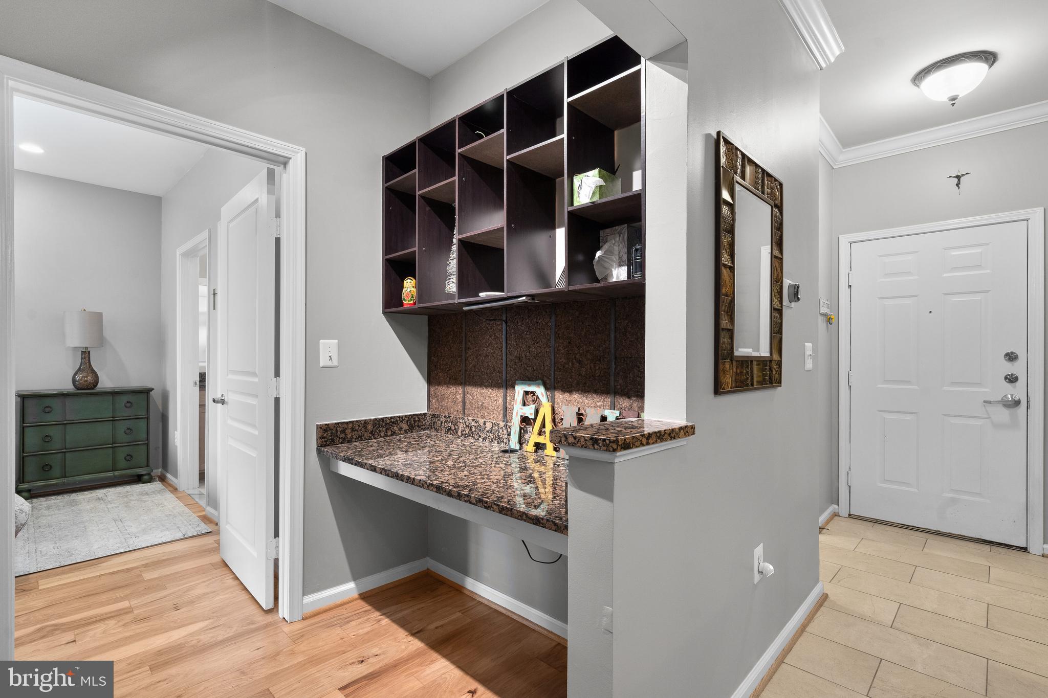 12000 Market Street, Unit 131 Reston, VA 20190 - Photo 14 of 41 a view of cabinets and entryway
