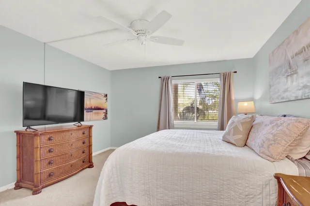 a bedroom with a flat screen television and a bed