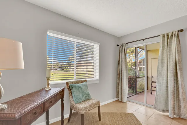 a workspace with furniture and a window
