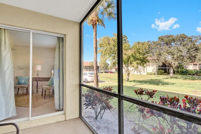 a view of a porch and a yard