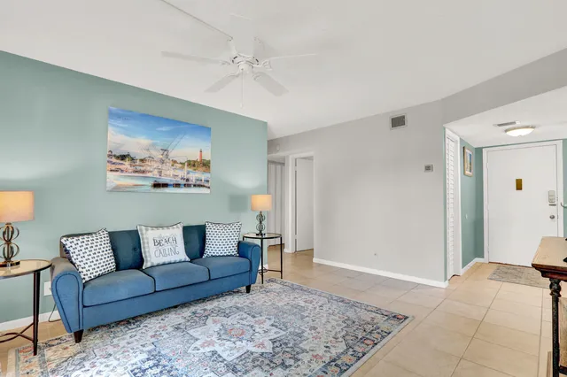 a living room with furniture and a rug