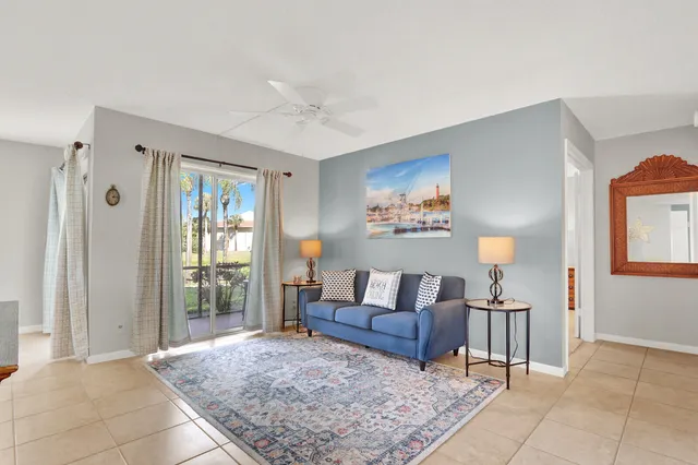a living room with furniture and a rug