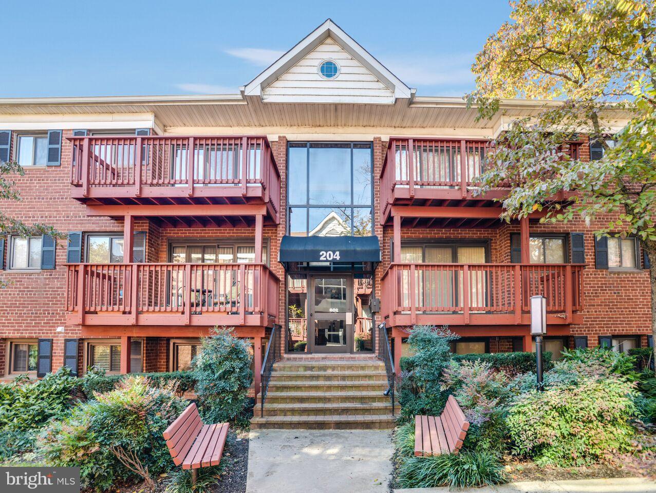 204 Skyhill Road, Unit 7 Alexandria, VA 22314 - Photo 1 of 20 a front view of a house with a garden and entryway