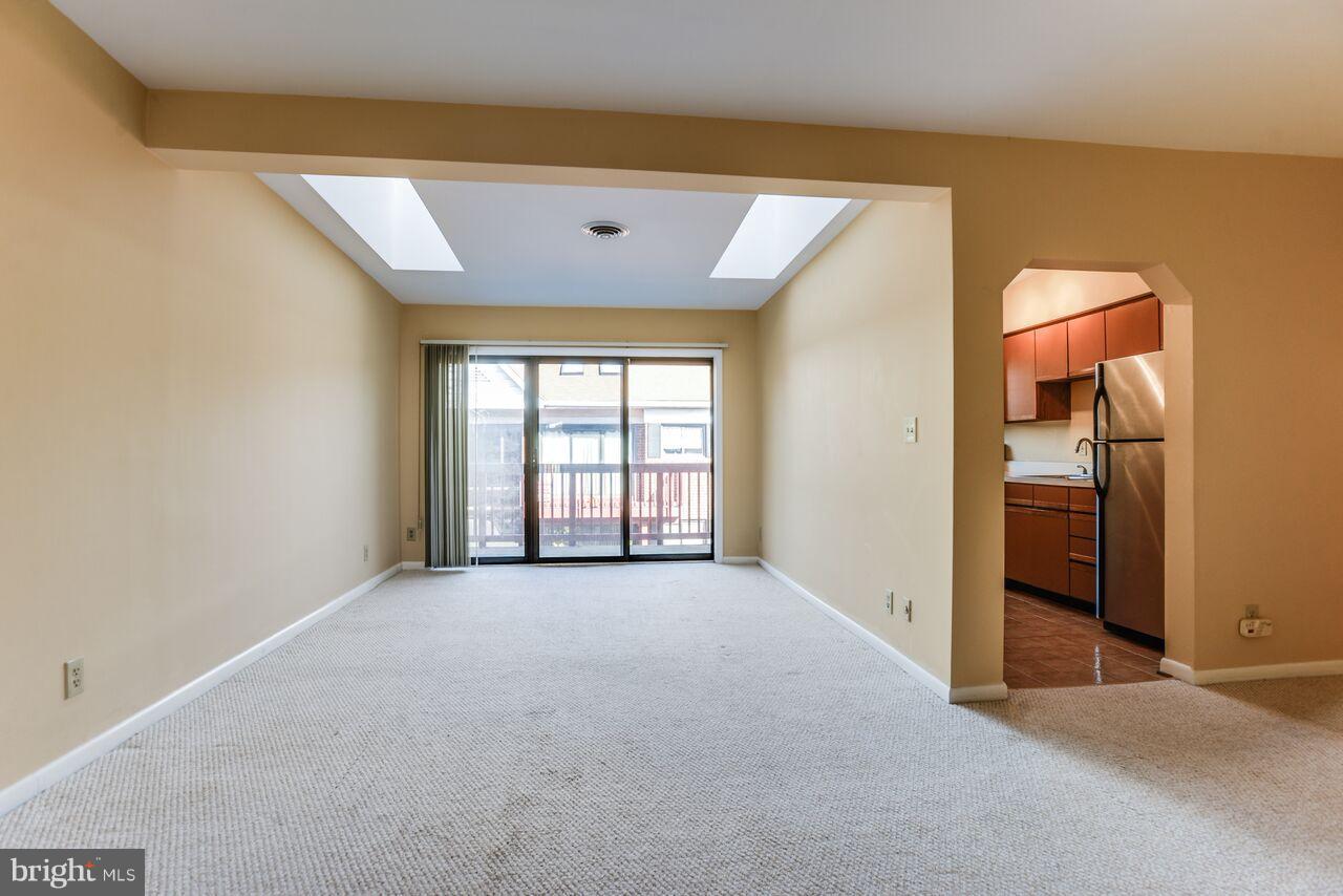 204 Skyhill Road, Unit 7 Alexandria, VA 22314 - Photo 2 of 20 an empty room with windows