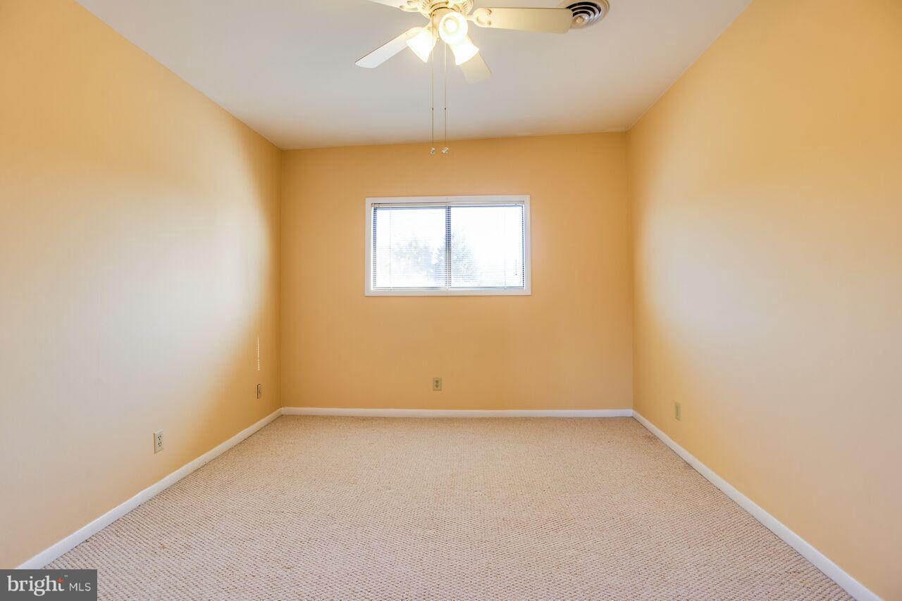 204 Skyhill Road, Unit 7 Alexandria, VA 22314 - Photo 17 of 20 an empty room with a window and a fan