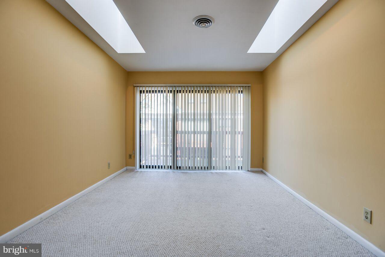 204 Skyhill Road, Unit 7 Alexandria, VA 22314 - Photo 3 of 20 a view of an empty room with a window