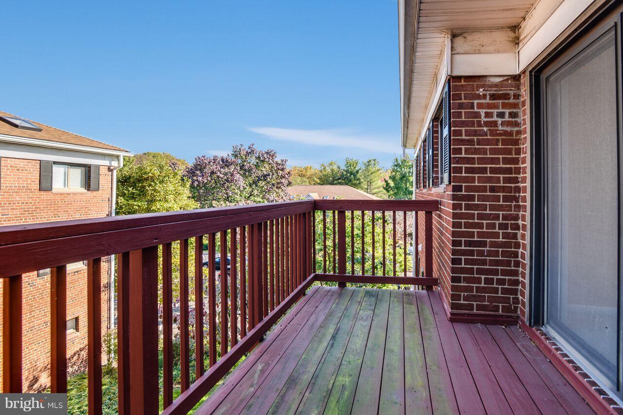 204 Skyhill Road, Unit 7 Alexandria, VA 22314 - Photo 4 of 20 a view of a balcony with wooden floor