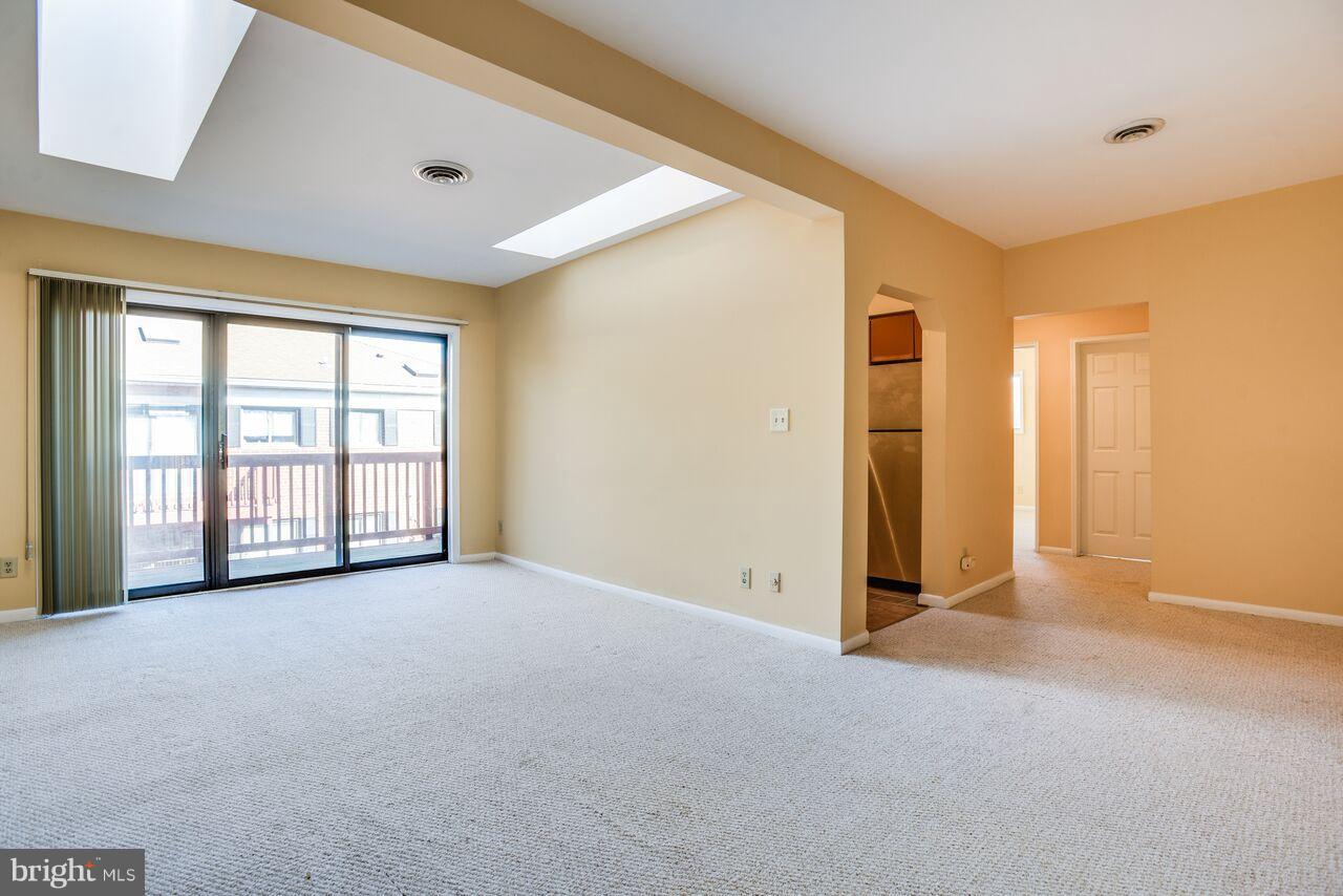 204 Skyhill Road, Unit 7 Alexandria, VA 22314 - Photo 7 of 20 a view of an empty room with a window