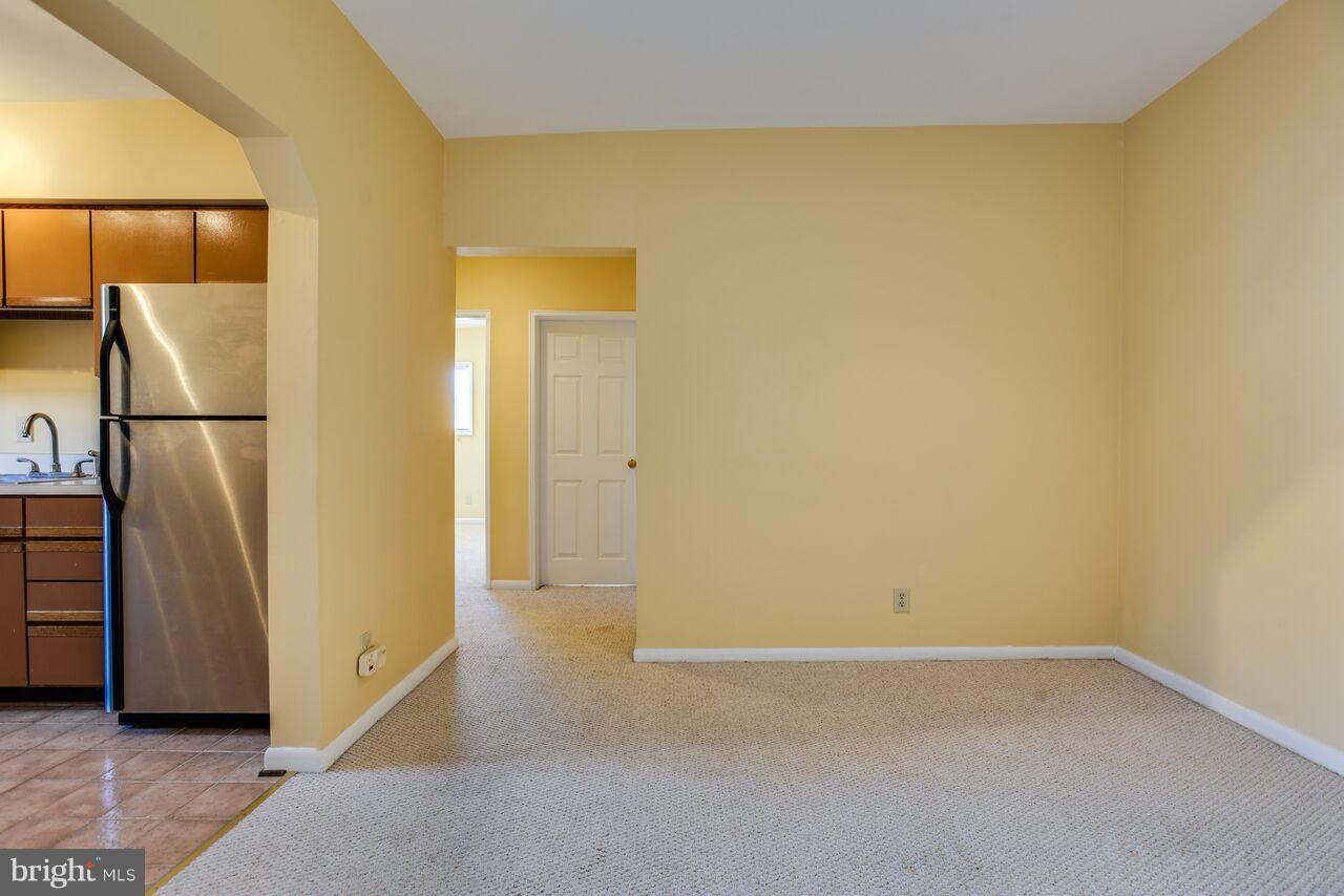 204 Skyhill Road, Unit 7 Alexandria, VA 22314 - Photo 9 of 20 a view of a room with a refrigerator