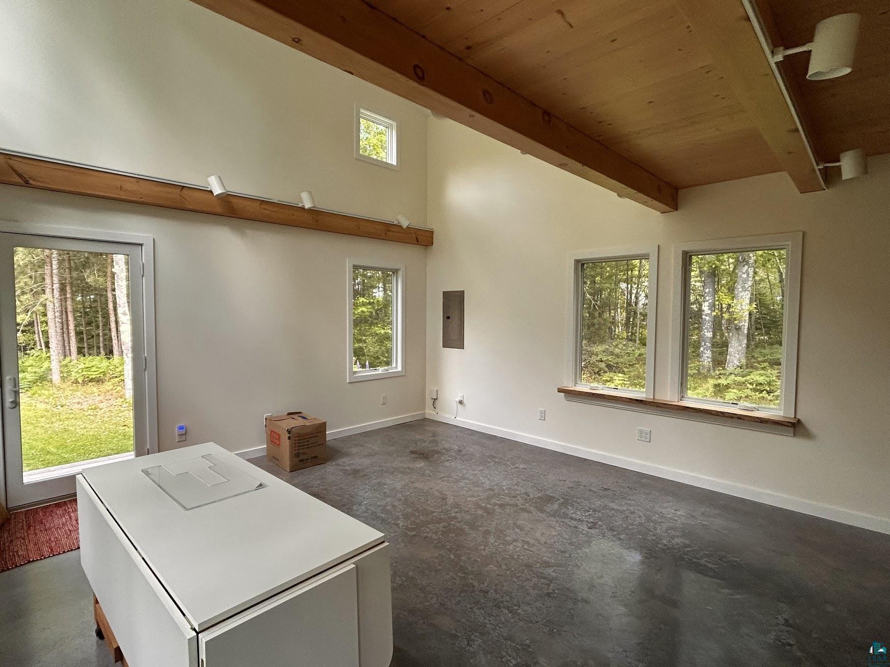 1596 North Shore Road La Pointe, WI 54850 - Photo 11 of 21 Vaulted wood-paneled ceiling with exposed wood beams