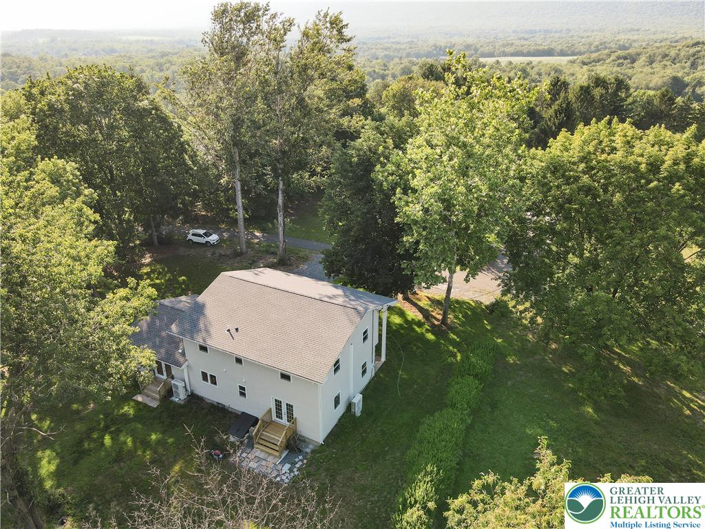 919 Point Phillips Road Bath, PA 18014 - Photo 54 of 59 An aerial perspective reveals a private home nestled amidst a verdant, expansive landscape.