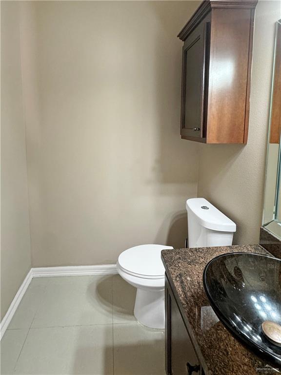 1909 North 45th Street McAllen, TX 78501 - Photo 11 of 22 a bathroom with a toilet and a sink