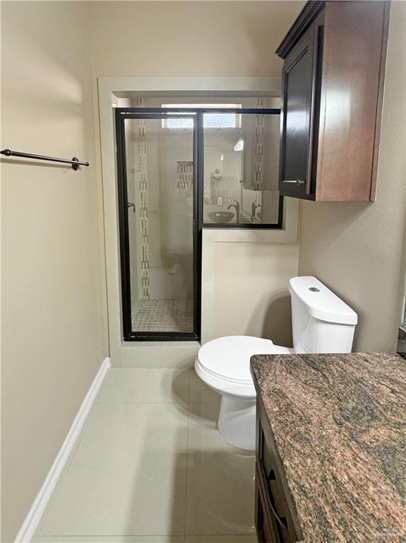 1909 North 45th Street McAllen, TX 78501 - Photo 14 of 22 a bathroom with a sink toilet and shower