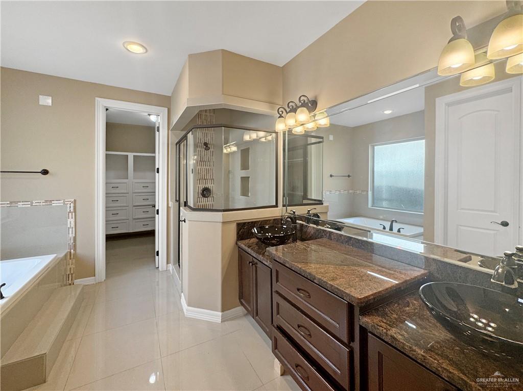 1909 North 45th Street McAllen, TX 78501 - Photo 16 of 22 a bathroom with a double vanity sink and a mirror