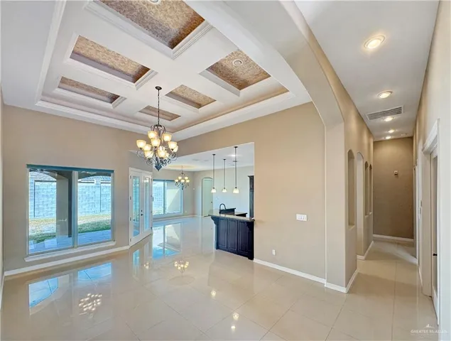 wooden floor in an empty room with a bathroom