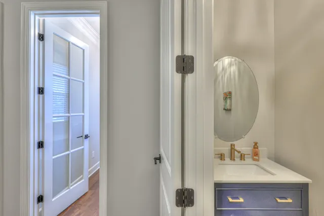 a bathroom with a granite countertop sink a toilet and shower