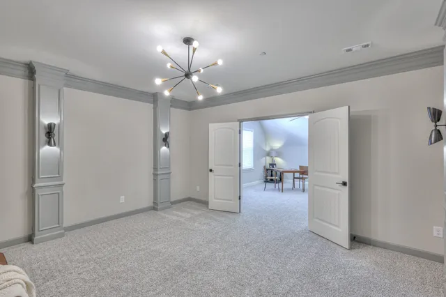 a living room with furniture fireplace and a large window