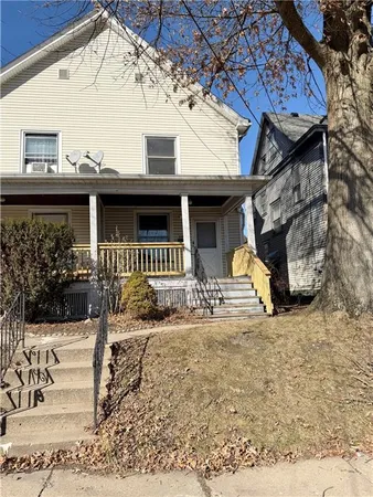 a front view of a house with a porch