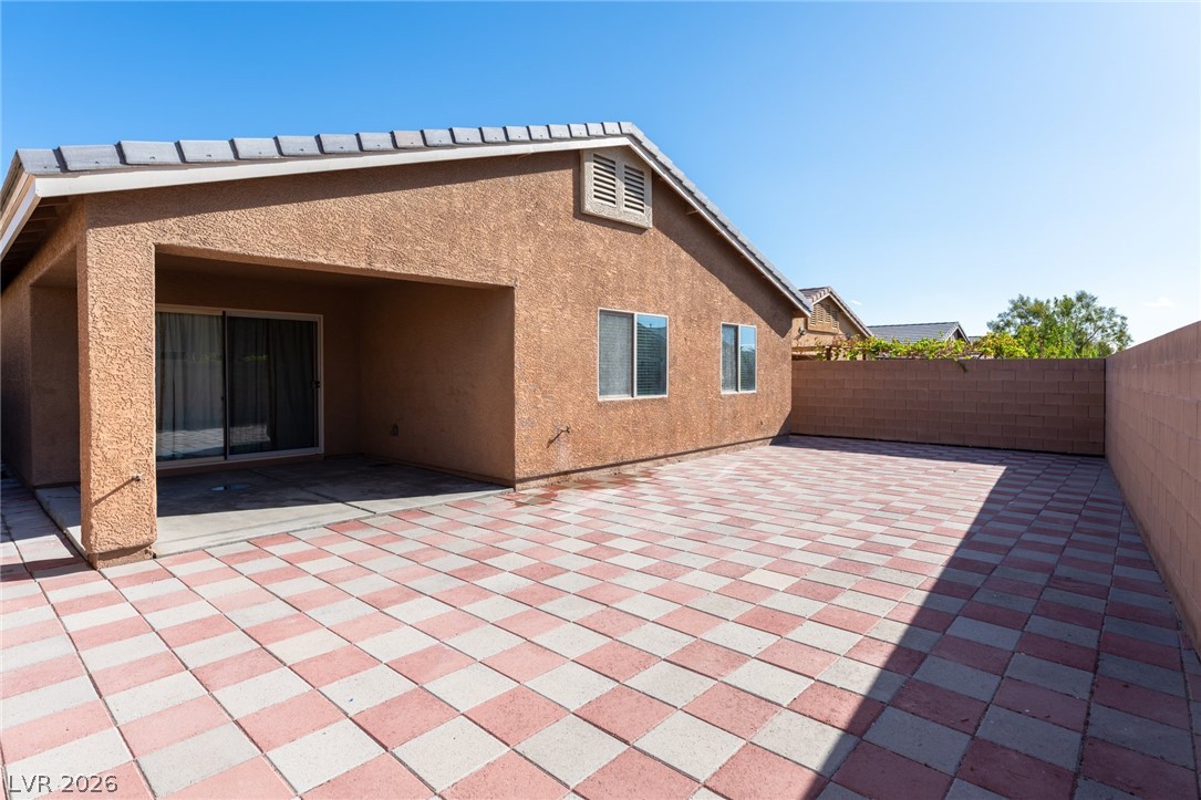 8079 Buffalo Ranch Avenue Las Vegas, NV 89147 - Photo 29 of 29 A spacious paved patio area is ideal for outdoor gatherings and relaxation.