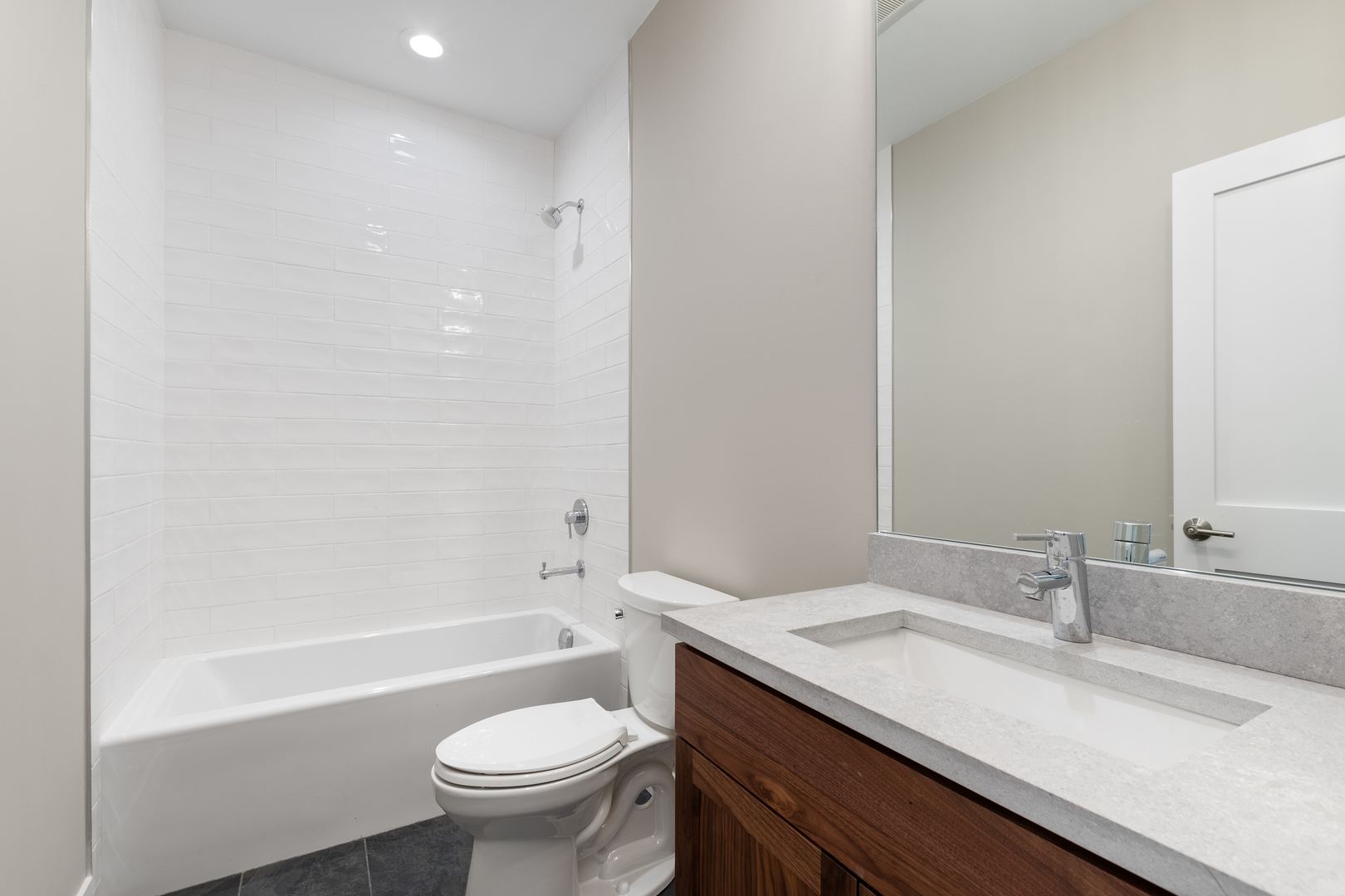 Undisclosed Address Chicago, IL 60640 - Photo 14 of 23 a bathroom with a granite countertop sink a toilet and a bathtub