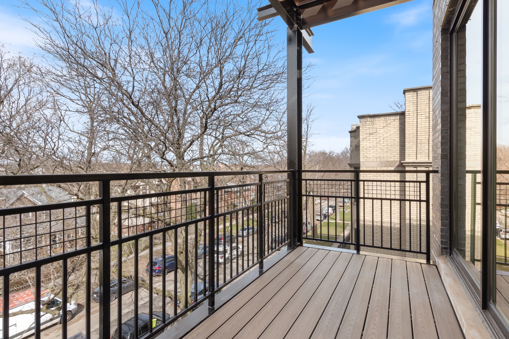 Undisclosed Address Chicago, IL 60640 - Photo 5 of 23 a view of a balcony with wooden floor