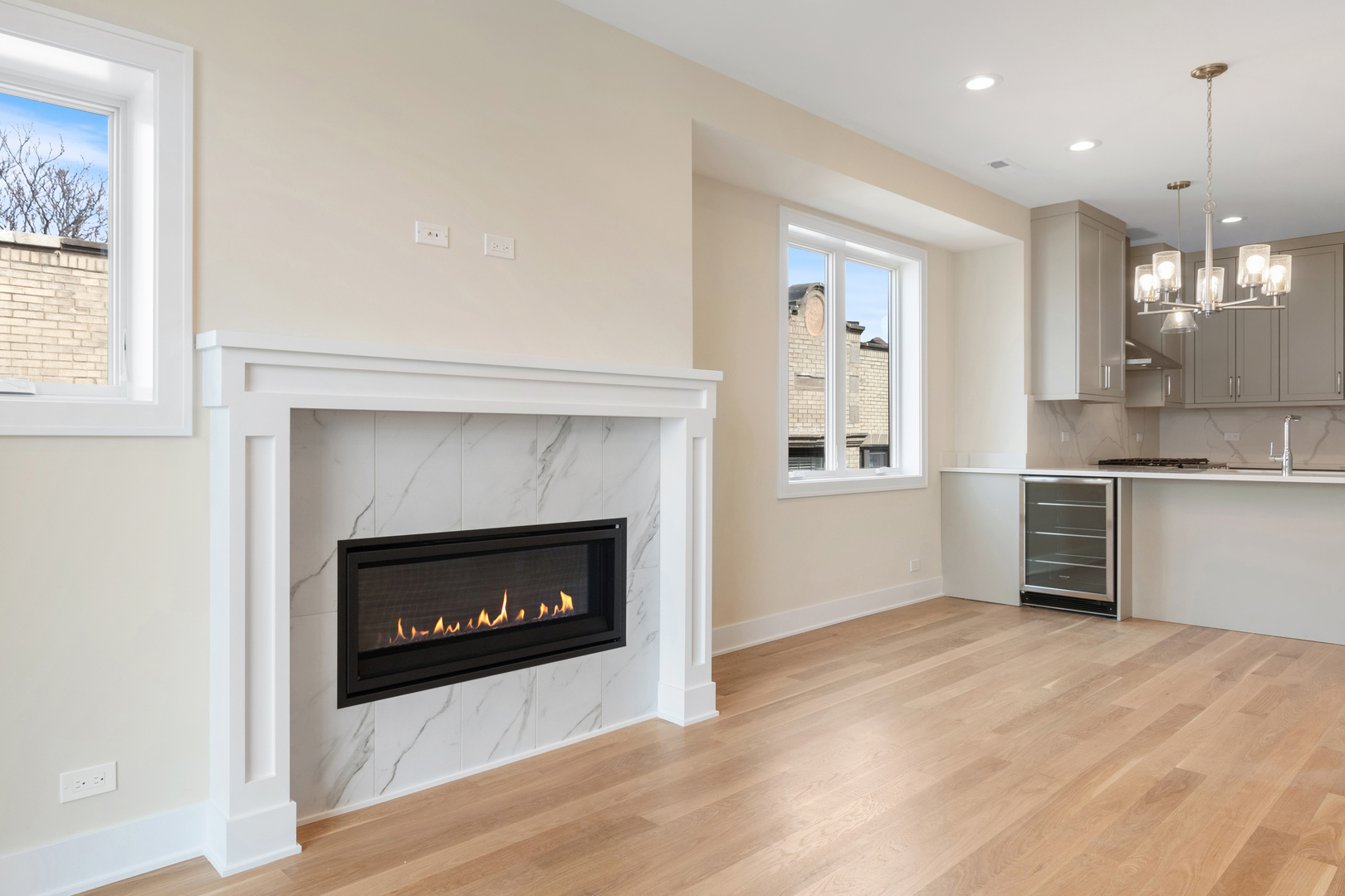 Undisclosed Address Chicago, IL 60640 - Photo 7 of 23 a view of kitchen and empty room with wooden floor