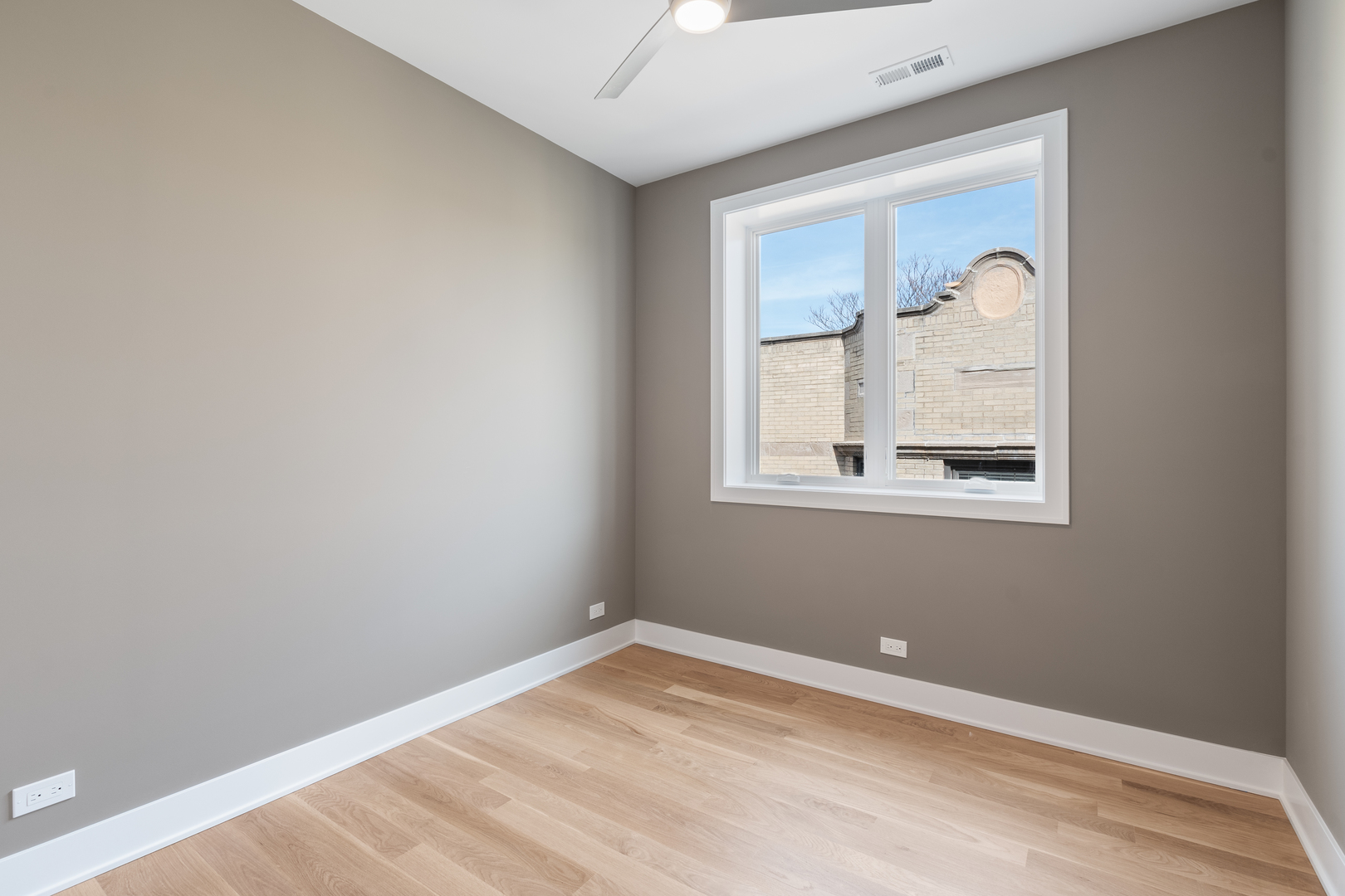 Undisclosed Address Chicago, IL 60640 - Photo 10 of 23 a room with a window and ceiling fan