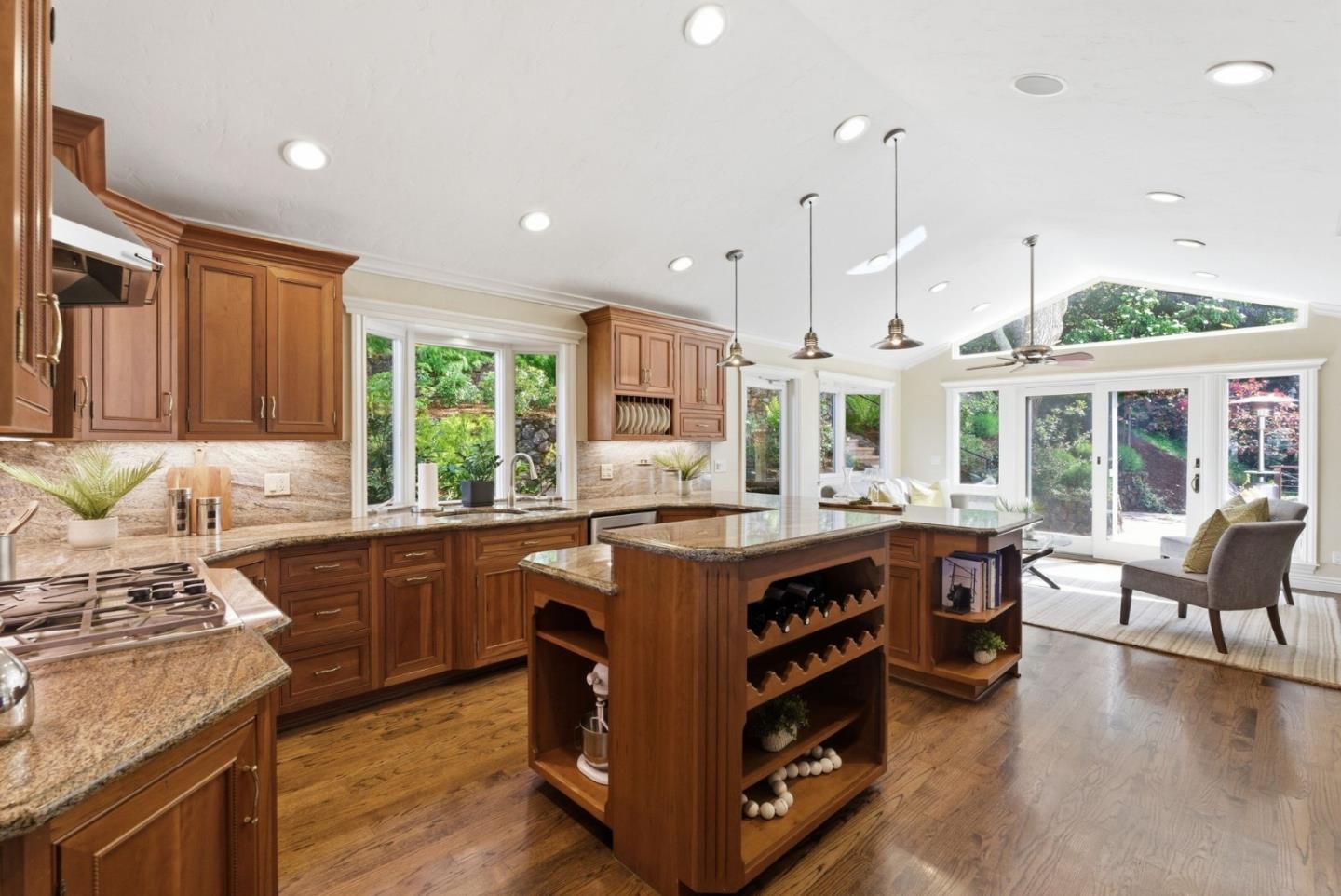 2884 Roland Avenue San Carlos, CA 94070 - Photo 14 of 27 a kitchen with stainless steel appliances granite countertop a stove and a large window