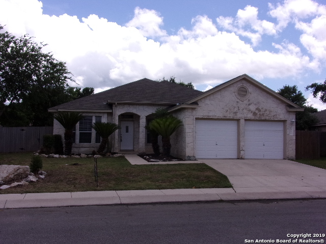 9352 Cedar Point Helotes, TX 78023 - Photo 1 of 1 a front view of a house with garden