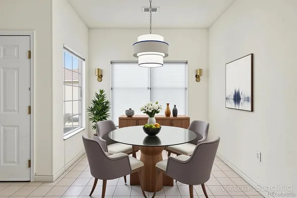 a dining room with furniture and window