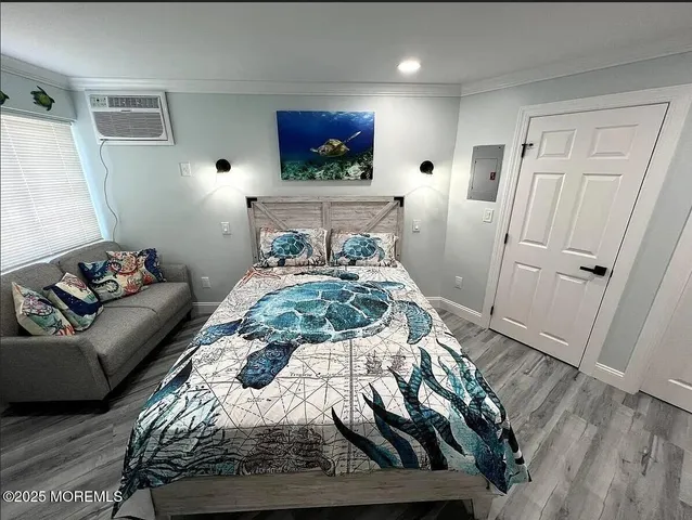 a bedroom with a bed and a flat screen tv