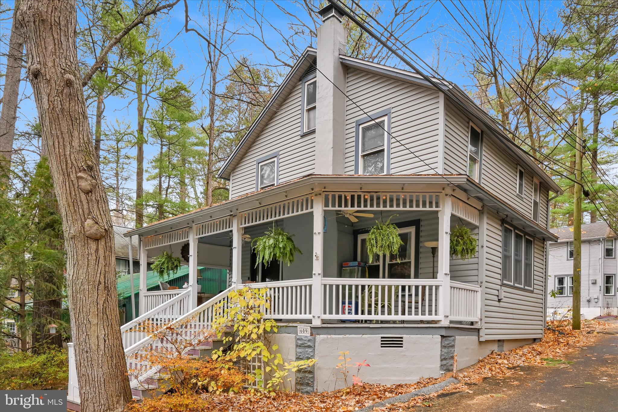 609 6th Street Mount Gretna, PA 17064 - Photo 1 of 39 a view of a house with a small yard and wooden fence
