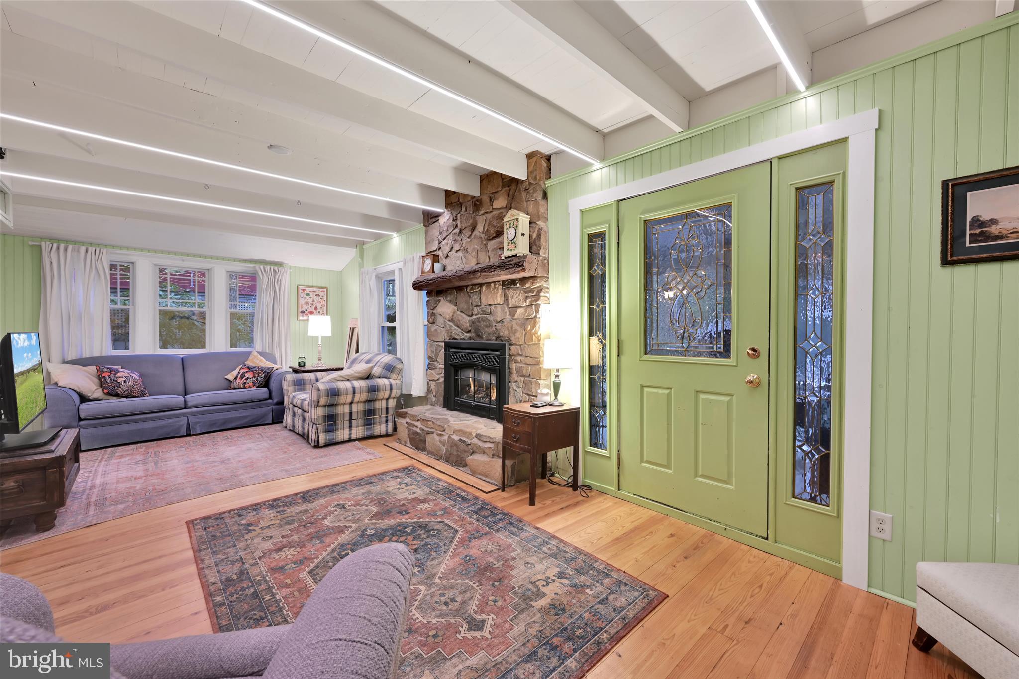 609 6th Street Mount Gretna, PA 17064 - Photo 11 of 39 a living room with furniture and a fireplace