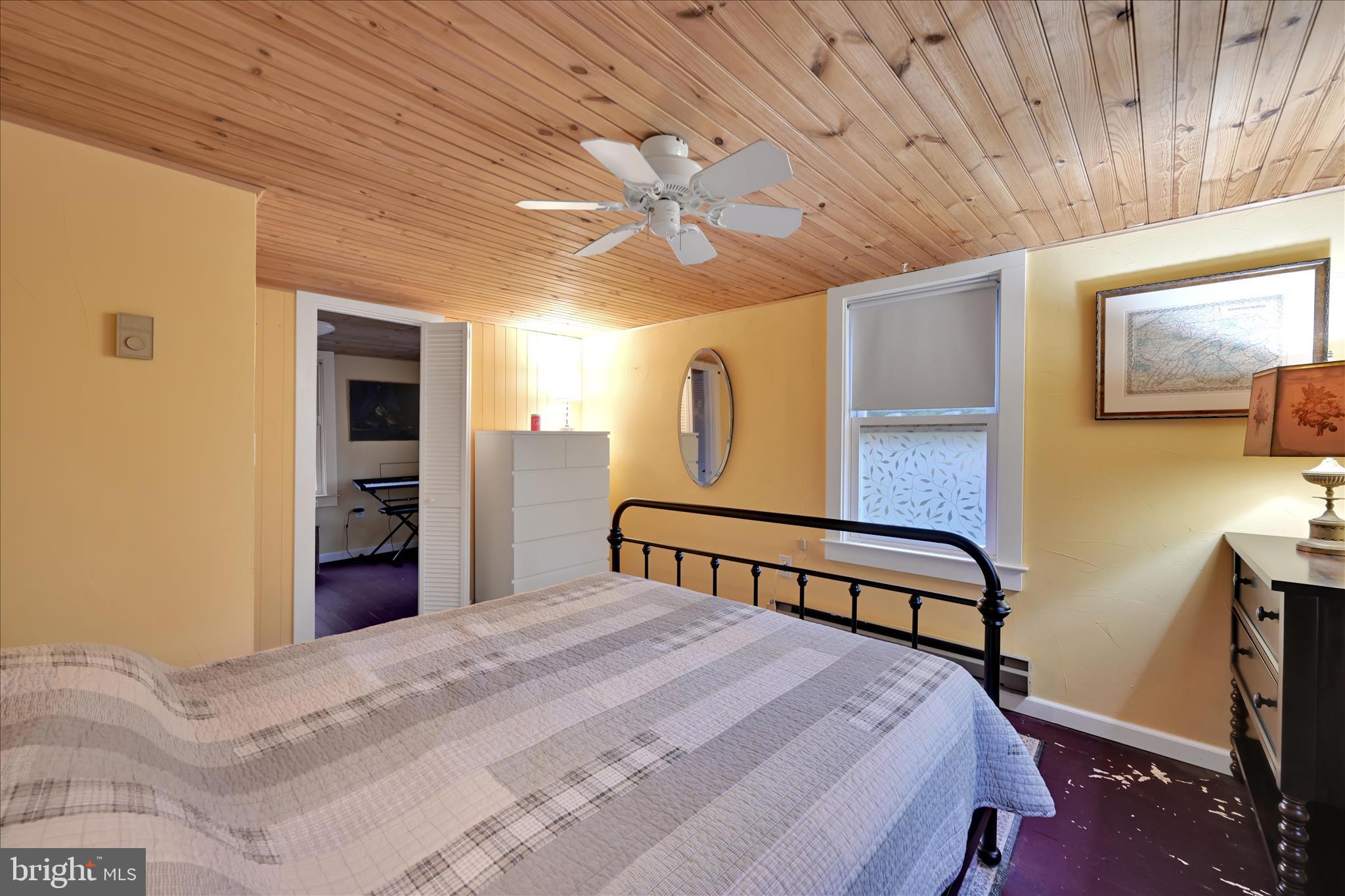 609 6th Street Mount Gretna, PA 17064 - Photo 23 of 39 a bedroom with a bed and a chandelier