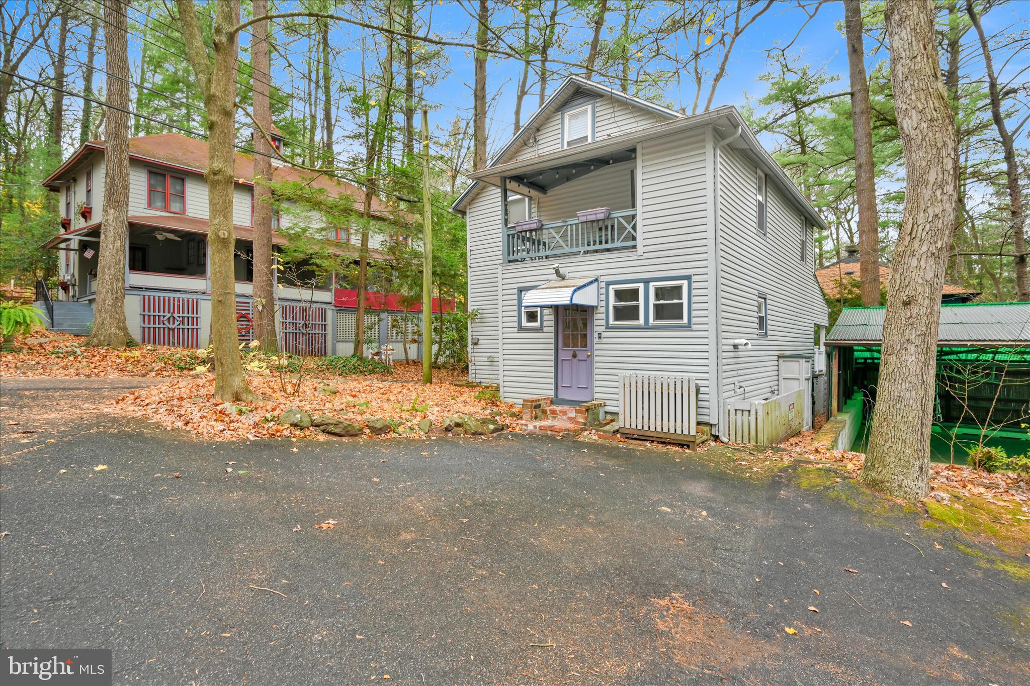 609 6th Street Mount Gretna, PA 17064 - Photo 33 of 39 a view of street house with large trees and a small yard