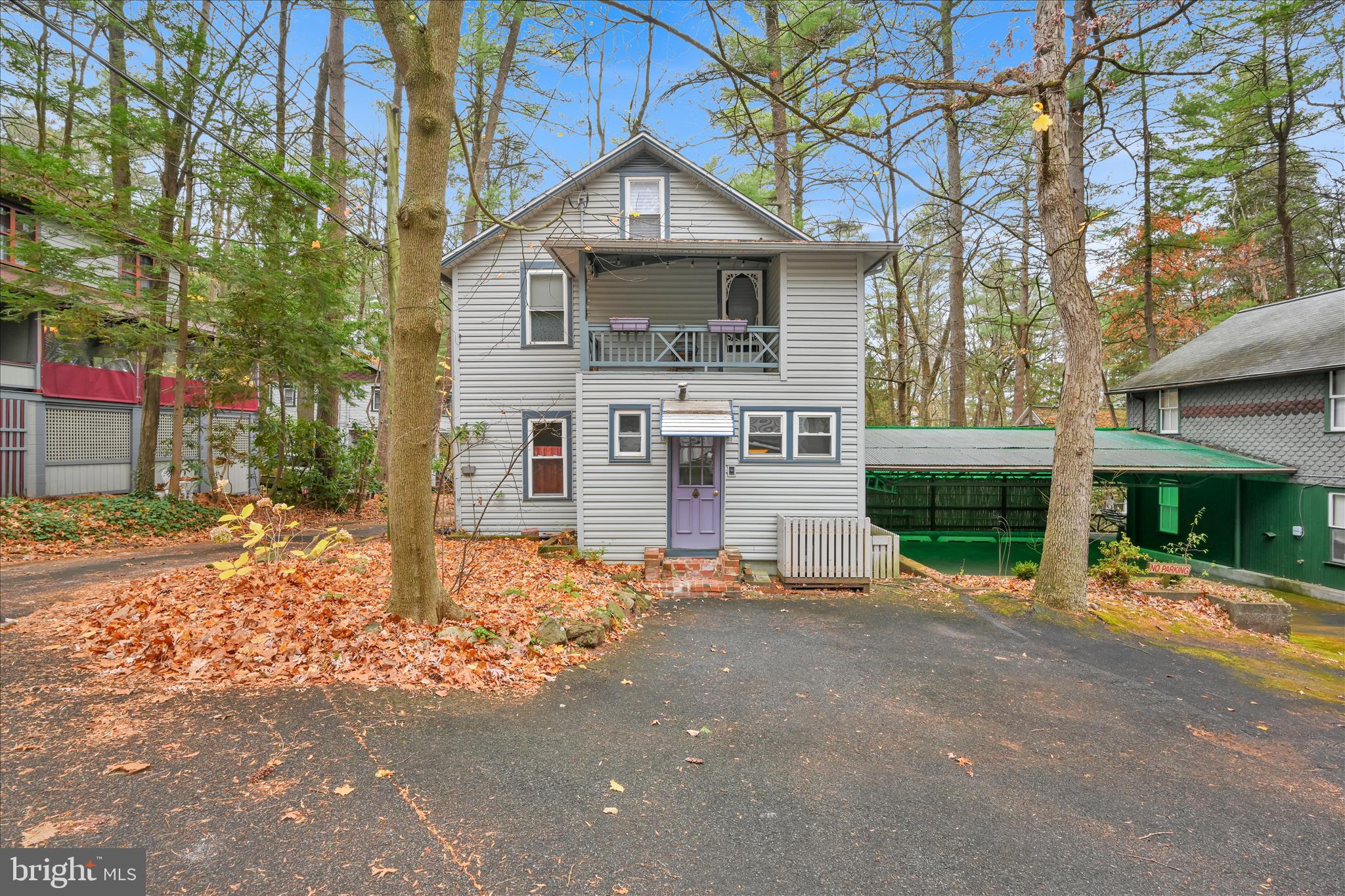 609 6th Street Mount Gretna, PA 17064 - Photo 5 of 39 a front view of a house with a yard and garage