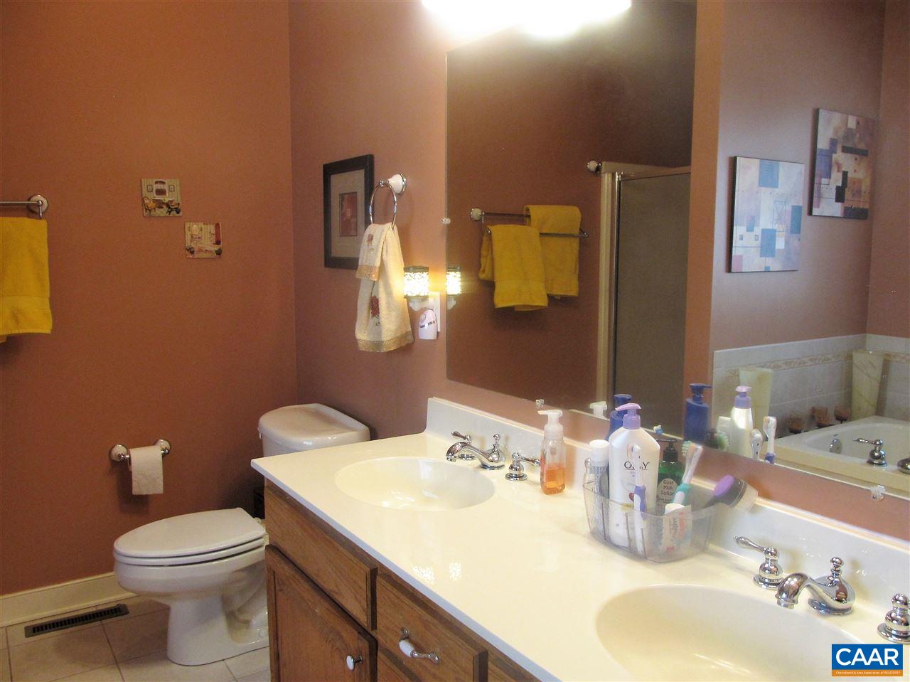4109 Venable Road Kents Store, VA 23084 - Photo 16 of 28 a bathroom with a granite countertop sink and a mirror