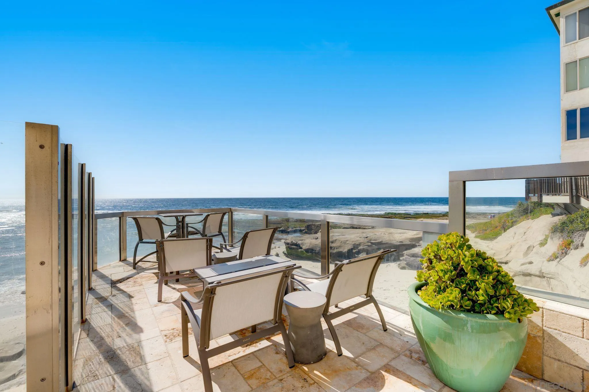 202 Coast Boulevard, Unit 6 La Jolla, CA 92037 - Photo 17 of 22 a balcony with outdoor seating and plants