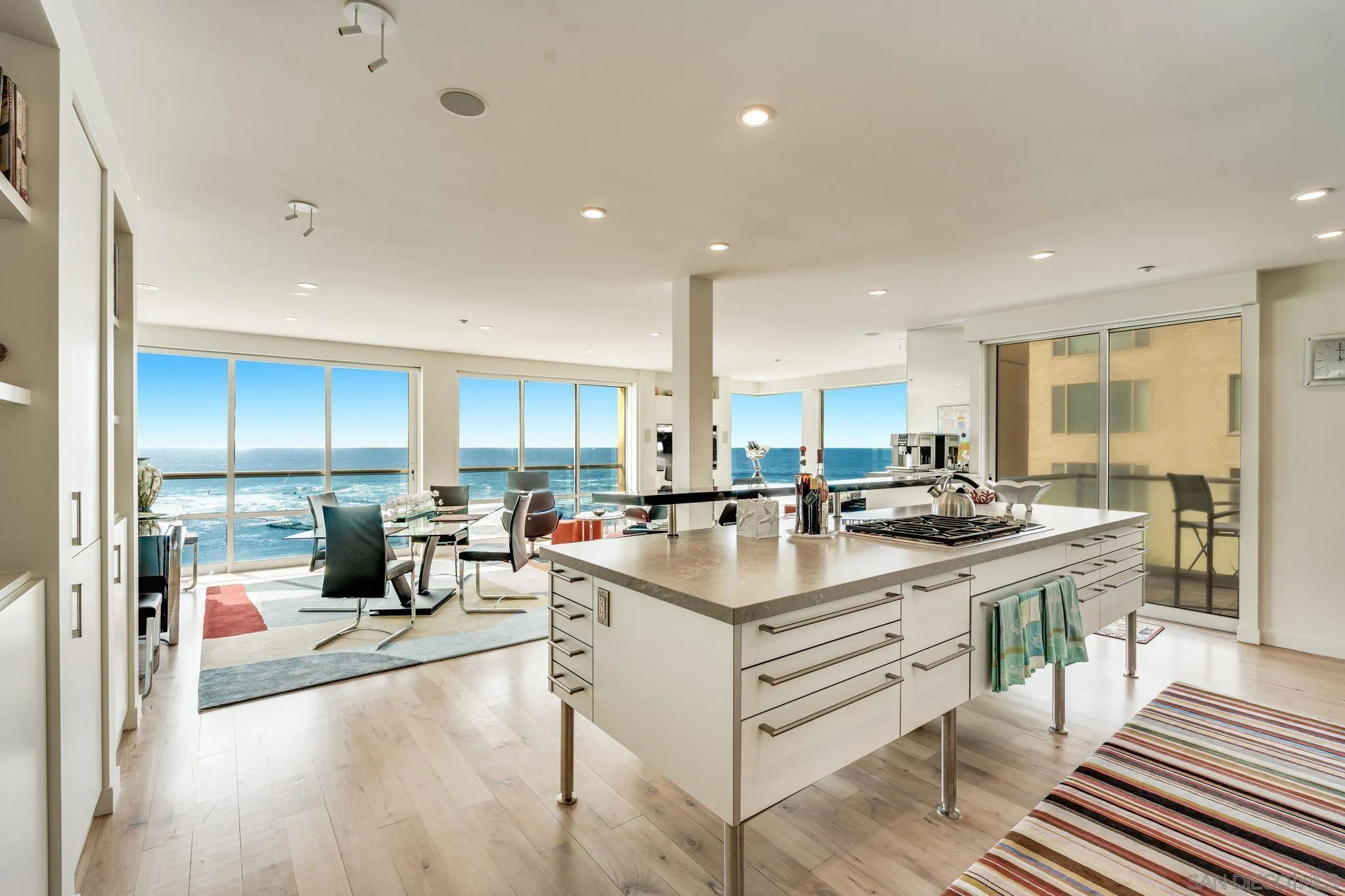 202 Coast Boulevard, Unit 6 La Jolla, CA 92037 - Photo 2 of 22 a kitchen with counter top space a sink cabinets and appliances