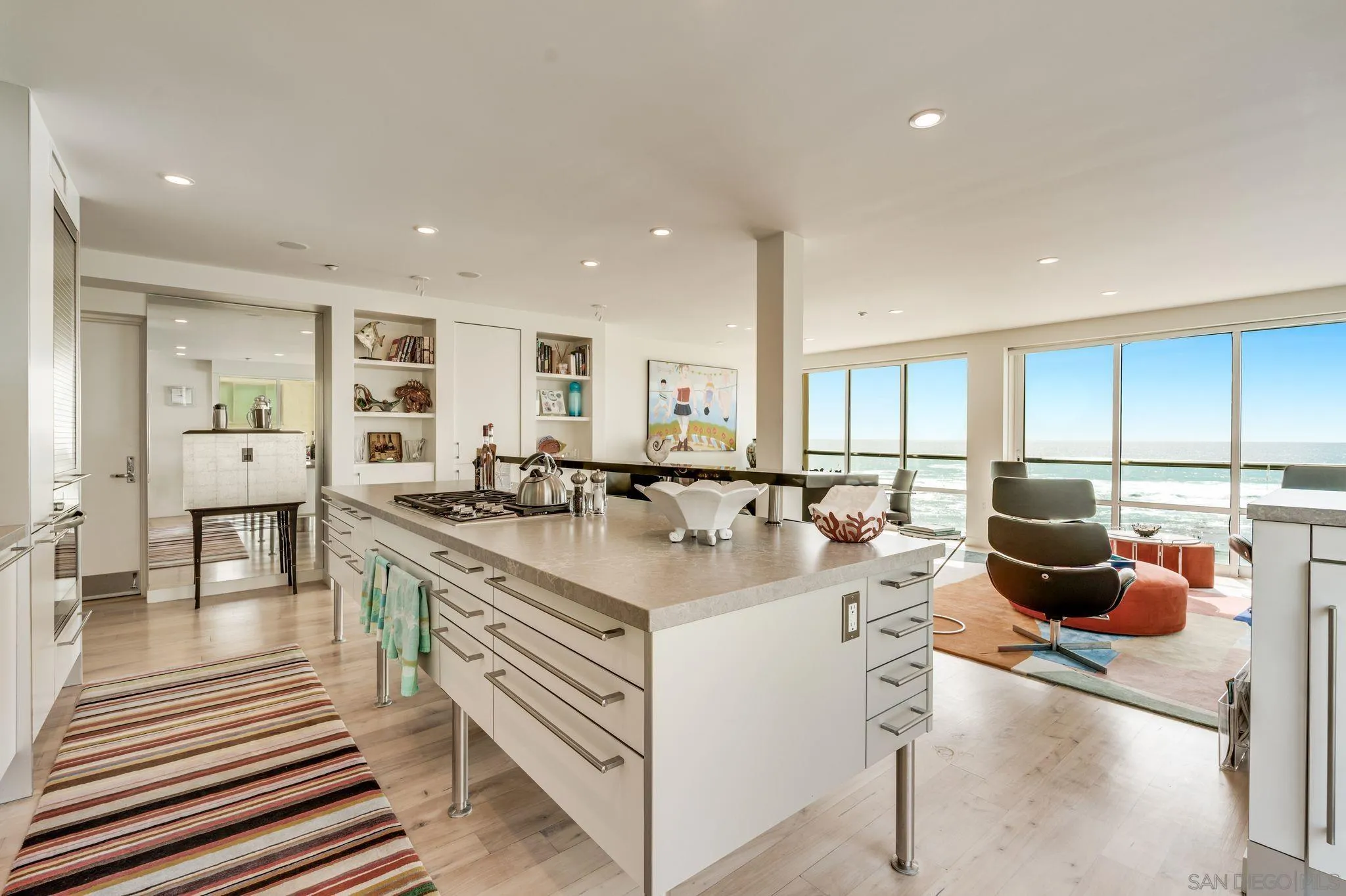 202 Coast Boulevard, Unit 6 La Jolla, CA 92037 - Photo 4 of 22 a kitchen with stainless steel appliances granite countertop a stove and a sink