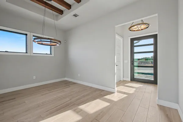a view of a kitchen with a sink dishwasher a kitchen counter space and wooden floor
