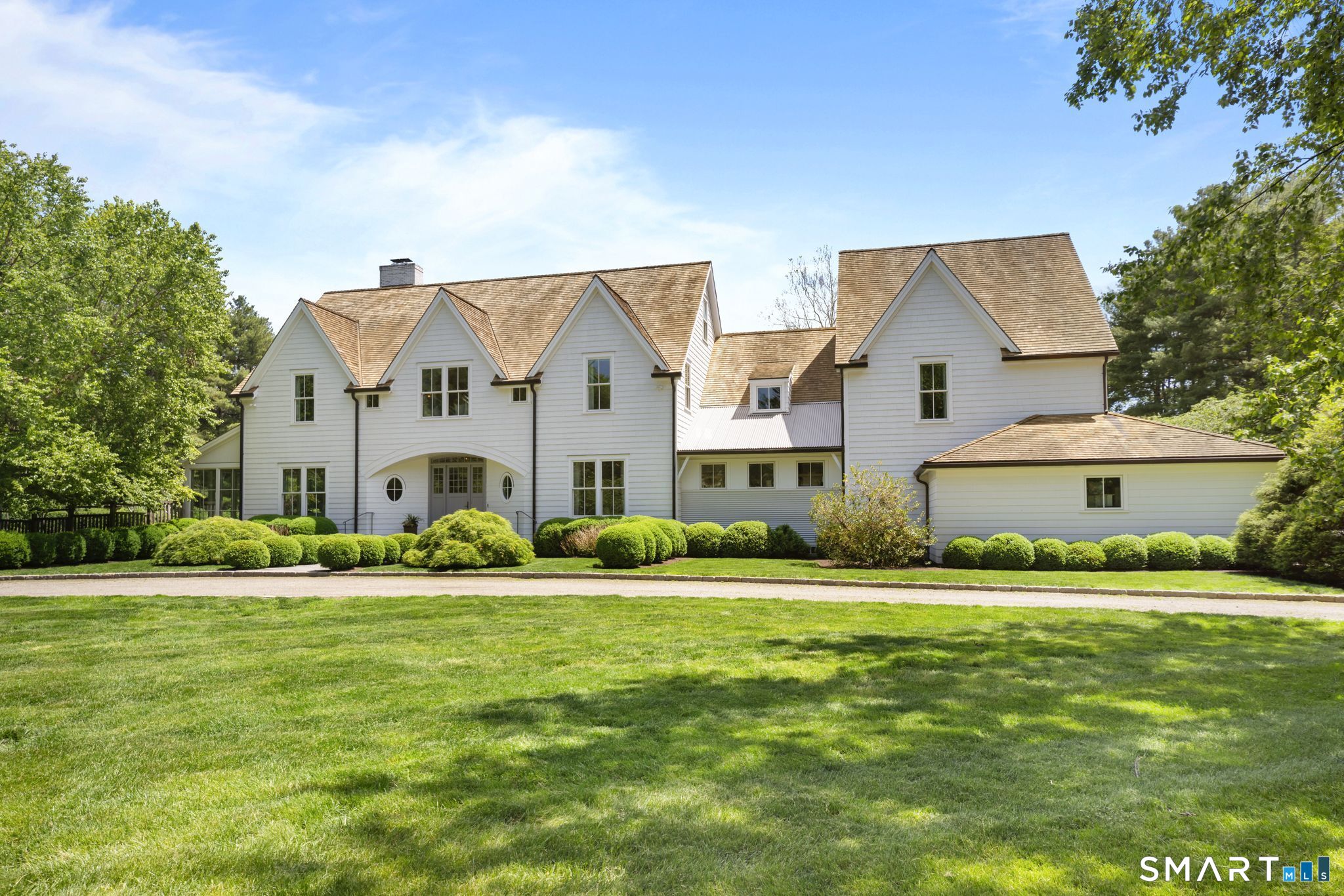 a front view of building with yard and green space