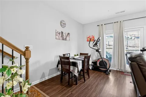 a view of a workspace with furniture and a workspace