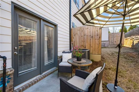 a outdoor space with a table and chairs