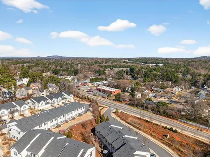 an aerial view of residential building and ocean view