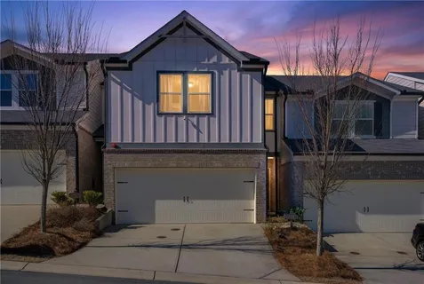 a front view of a house with parking