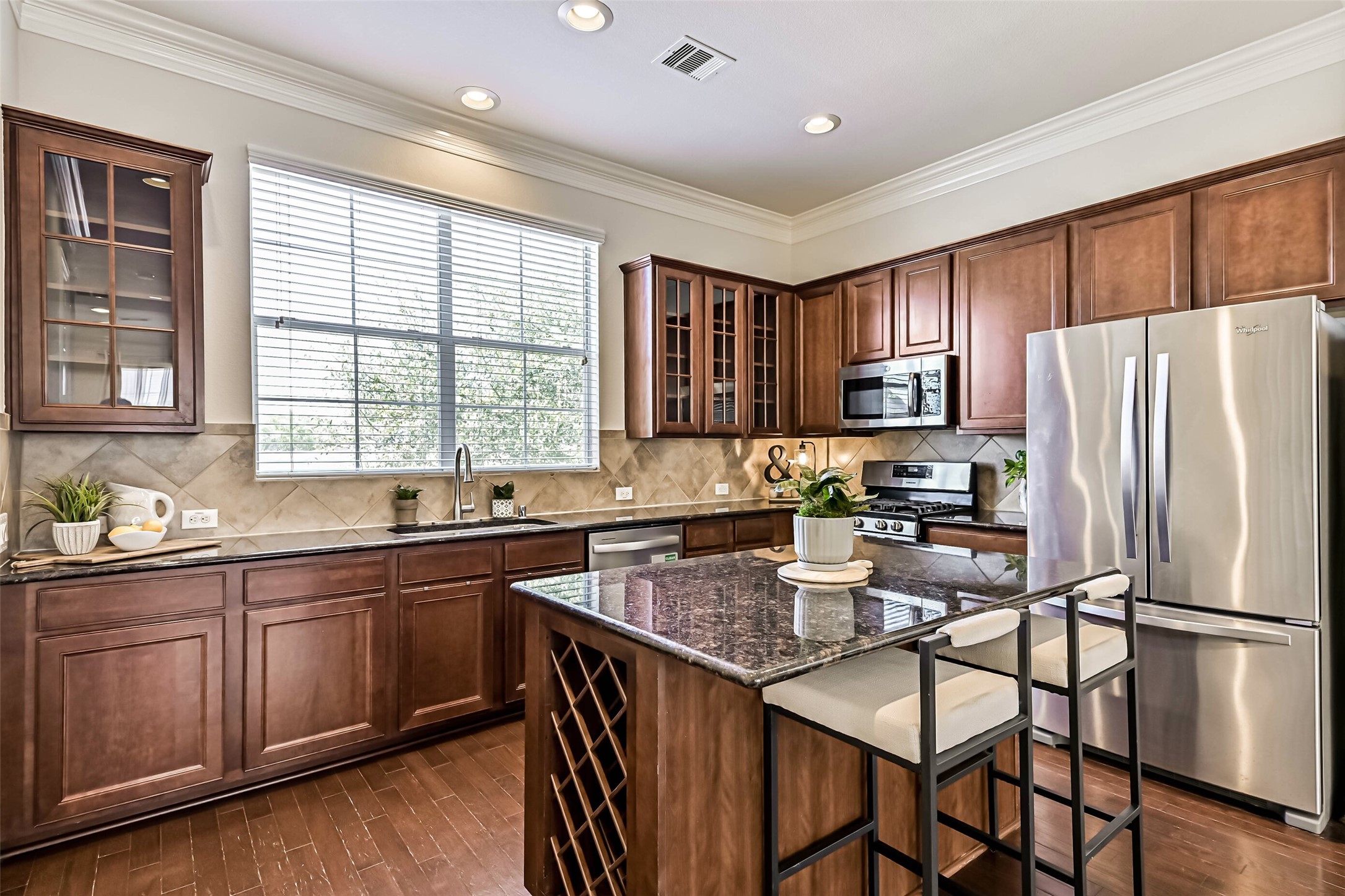3208 Clearview Circle Houston, TX 77025 - Photo 3 of 30 Designed with both function and flow in mind, the kitchen offers strong workspace and storage.