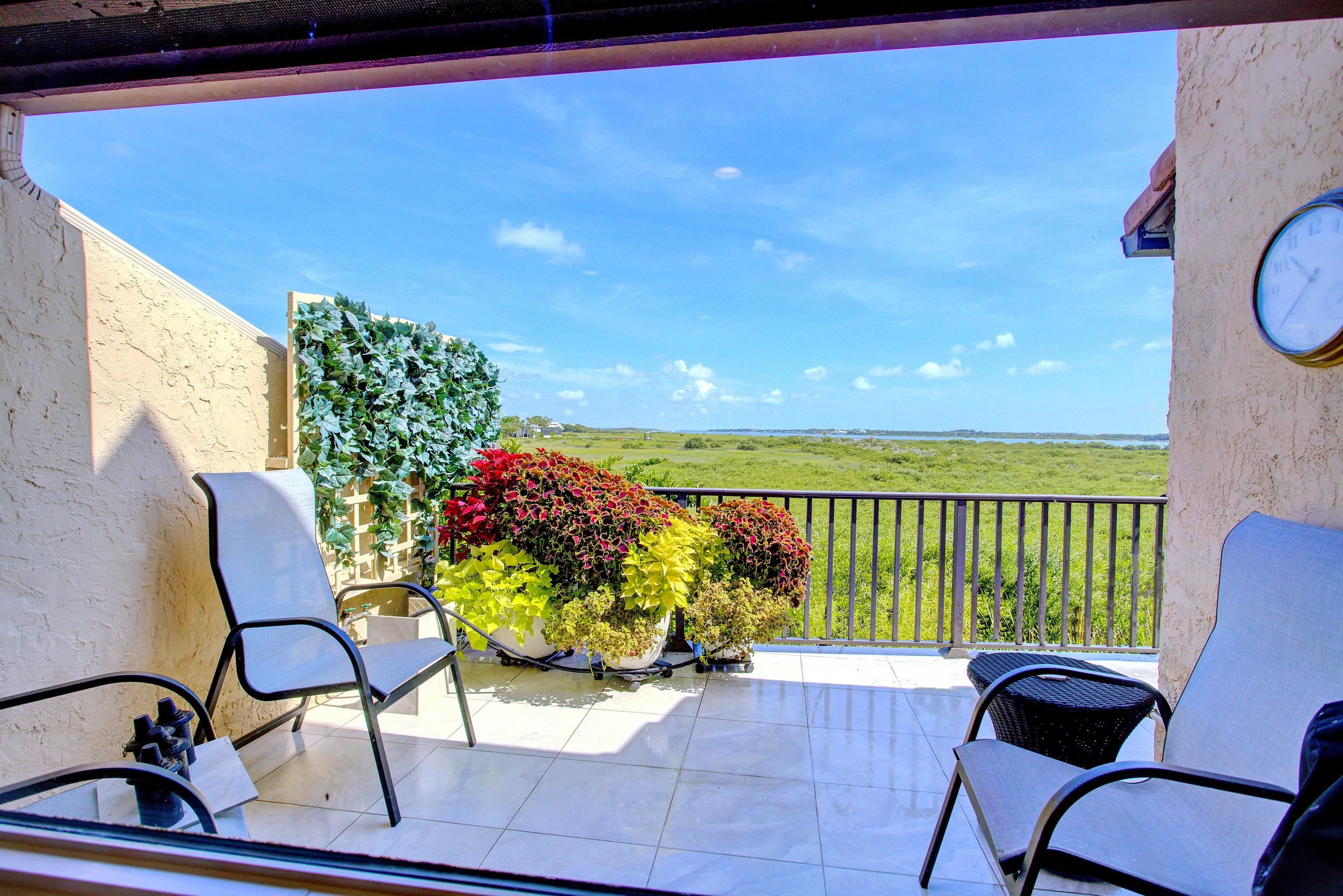 3431 Harbor Drive St. Augustine, FL 32084 - Photo 30 of 61 a view of a chairs and table in the balcony